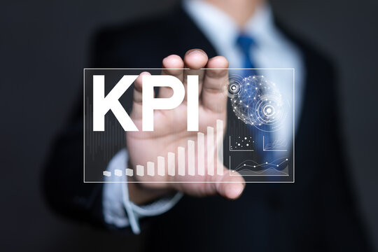 KPI Key Performance Indicator concept with businessman and digital financial analytics dashboard.
