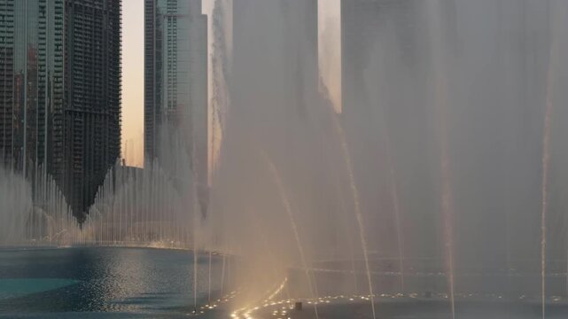 Iconic Dubai fountain during sunset, a famous tourist attraction