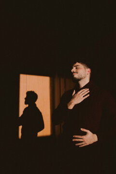 Emotional portrait with dramatic light and shadow