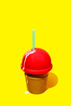 Dripping red ice cream bottle with blue straw on yellow background