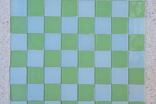 Colorful Checkered Tile Floor with Green and Light Blue Squares in Patterns