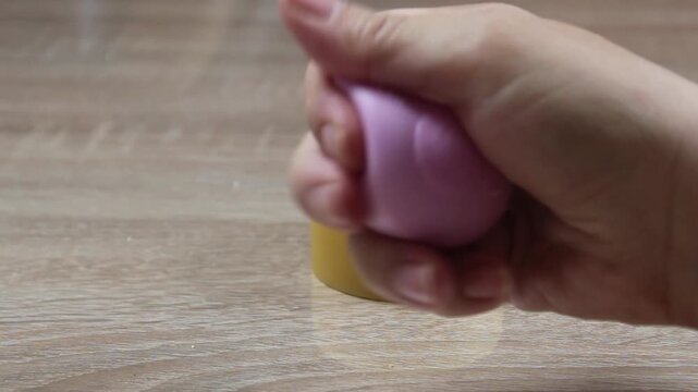 Mom Plays With Her Hand With A Toy Anti-Stress Close-Up