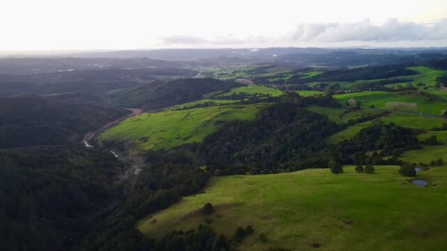 Aerial view of patchwork fields and rolling hills in New Zealand