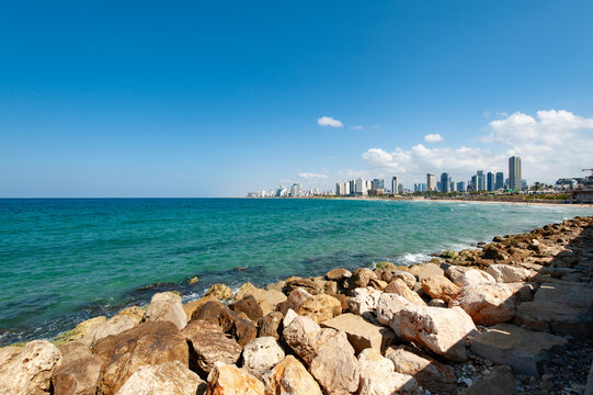 view of Tel Aviv from the rocky ridge of the sea shore