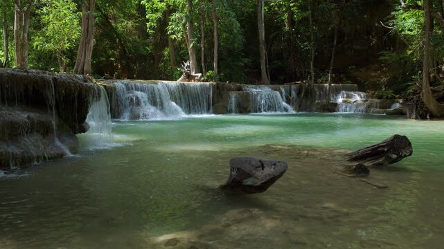 Tropical Huai Mea Khamin Waterfall Cascading Into Emerald Green Forest Pool In Kanchanaburi Thailand