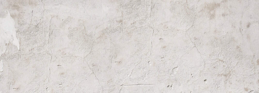 White concrete wall showing weathered texture background