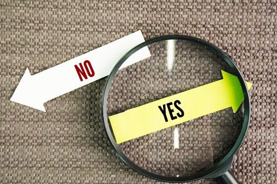 Magnifier with the words YES and NO. you are focusing on the positive aspects of the situation. It indicates agreement, approval, or that a condition is met&mdash;even if there are contrasting factors prese