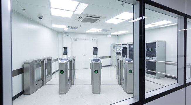 Modern cleanroom access control with turnstiles and server racks