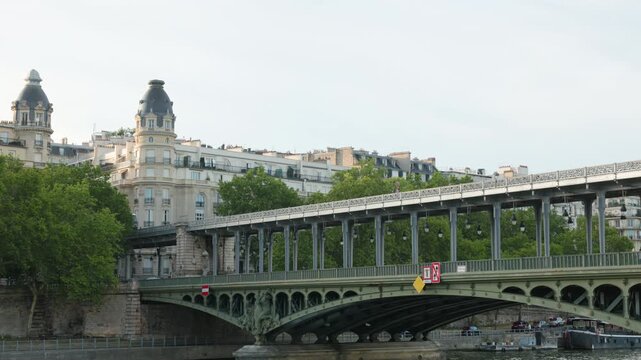 Paris Metro Train Arriving from the Viaduct Structure of Pont de Bir-Hakeim Against a Backdrop of Elegant Haussmann Architecture