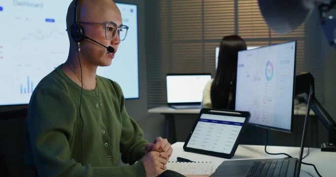 Professional female agent speaking into a microphone for a marketing campaign. This dedicated staff member provides support and contact for clients via cyberspace and technology. 