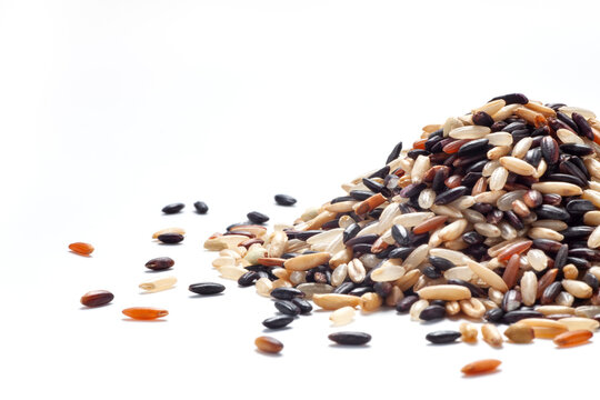 Pile of seven different organic rice grains on white backgroiund, Healthy food concept