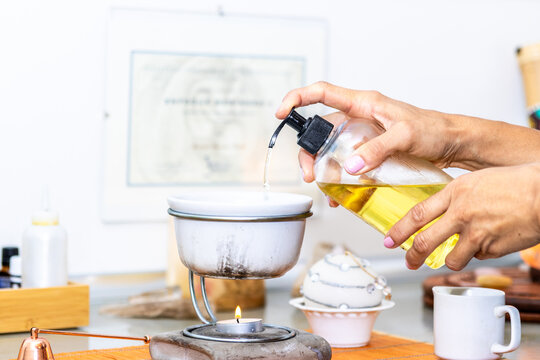 Preparing essential oil for a relaxing aromatherapy massage and wellness treatment