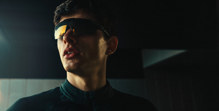 Runner wearing sport sunglasses in a close portrait for fitness and running eyewear advertising