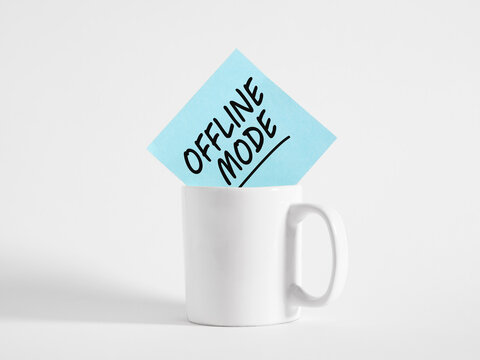 Offline mode note in mug representing digital detox