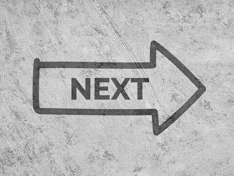 Next word arrow pointing right on concrete ground