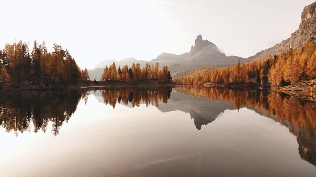 Crystal clear water. Lake Federa near the Croda da Lago mountain at autumn time, majestic landscape, raw nature.