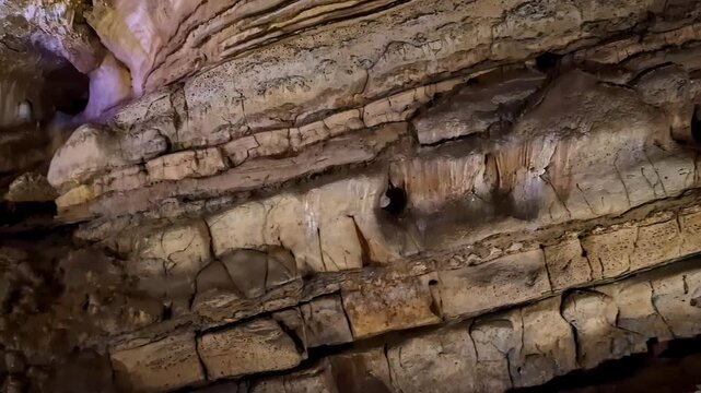 Layered limestone cave walls inside Sataplia Nature Reserve showcasing natural geological formations