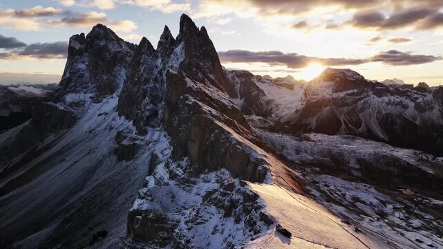 Bright sunlight is over horizon. Seceda mountain, aerial view of majestic nature, beautiful touristic place.