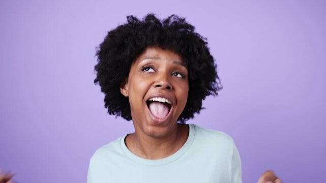 Young african american woman making different funny faces in slow motion