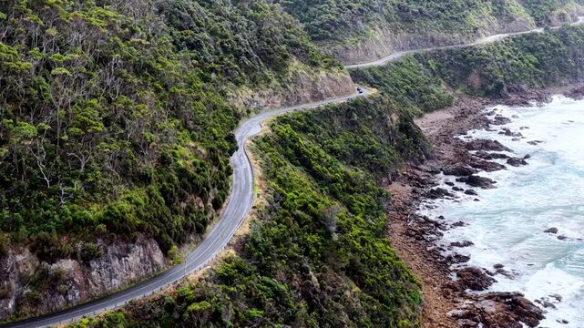 Turns on scenic Great Ocean road drive by the sea in Victoria of Australia &ndash; aerial.