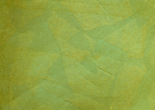 Green papier mache background for design. Toned rough paper surface. texture A painted old paper.	