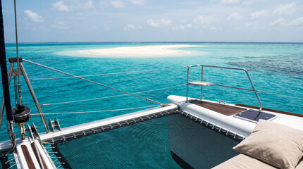 Obraz premium View from catamaran deck on turquoise tropical ocean.