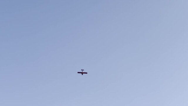 Small airplane in clear blue sky