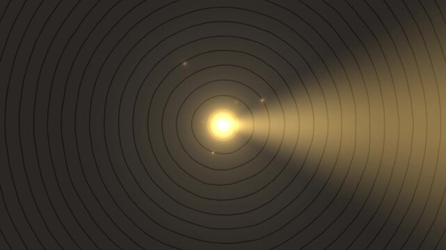 Bright light beam shining through concentric circles in dark setting