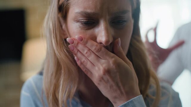 Stressful Caucasian woman crying suffering angry aggressive man yelling. Family quarrel conflict breakup divorce problem. Couple suffering misunderstanding wife cry sad husband yell abuse in bedroom