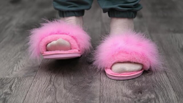 Female feet in ping slippers