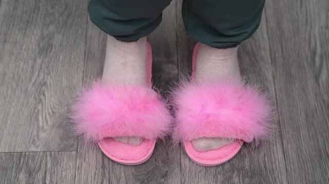 Female feet in ping slippers
