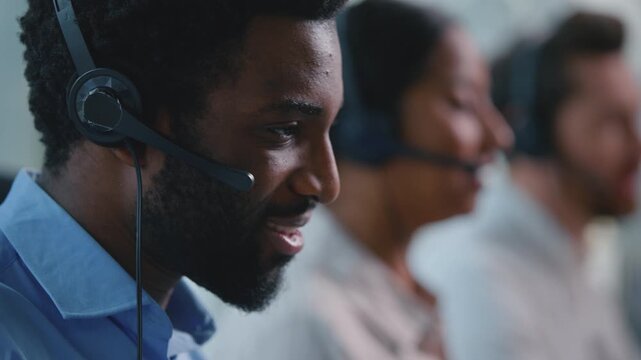 Close up three multiethnic call center workers talking with headsets diversity receptionists talk business team men woman operators consulting client in callcenter working in helpdesk bank hotline