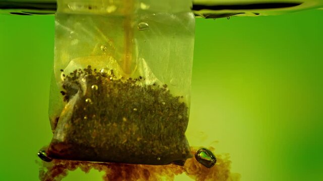 Super Slow Motion of Falling and Extracting Tea Bag in Hot Water at 1000fps.