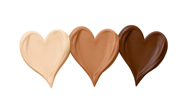 Three heart shapes of foundation makeup in different skin tones, isolated on transparent background