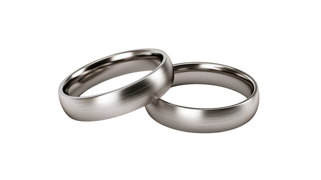 Two silver wedding bands with brushed metal finish on transparent background ring jewelry engagement marriage couple