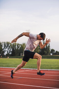 Athlete running on tartan track