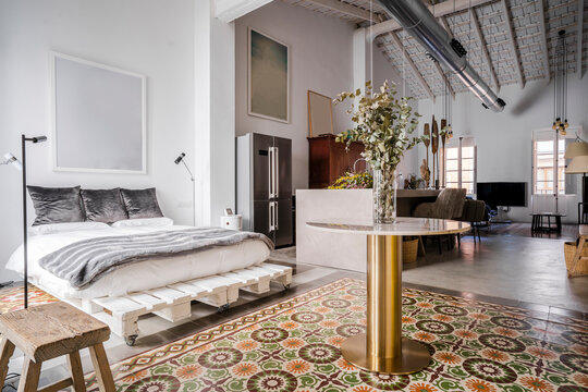 Interior of loft apartment with bed