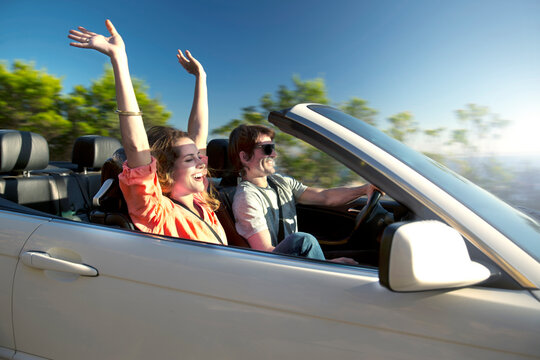 South Africa, happy couple in convertible