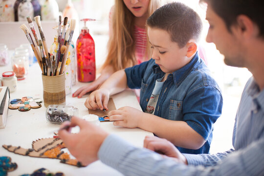Boy tinkering in art class