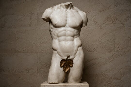 Classical marble sculpture of a male torso with bronze leaf covering.