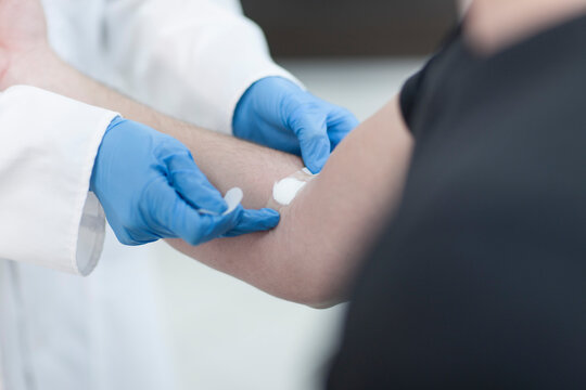 Doctor taking blood sample