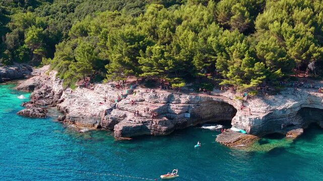 Aerial view of revealing famous shoreline of Galebove stijene near Pula, Croatia. Popular summer destination for swimming, cliff jumping, kayaking, and coastal exploration