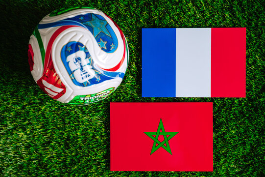 FIFA World Cup 2026 quarterfinal: France vs Morocco, national flags before international football match. Editorial football scene on green grass pitch inside stadium light, Foxborough, United States.