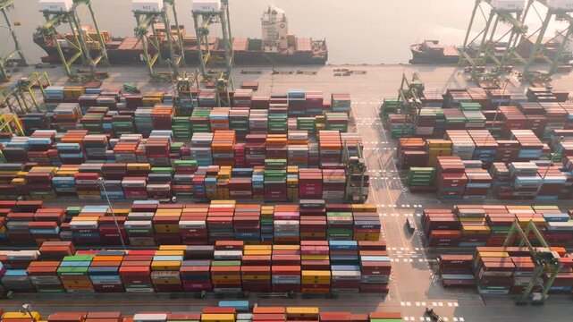 Top down aerial view of shipping container terminal yard at commercial port