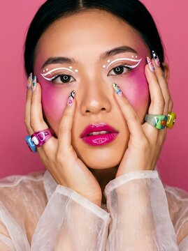Vibrant Portrait of a Young Woman with Artistic Graphic Eyeliner and Colorful Summer Aesthetic