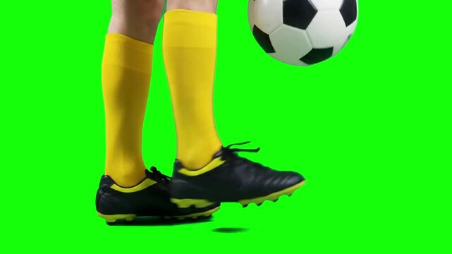Soccer Player Juggling Football Close Up on Green Screen