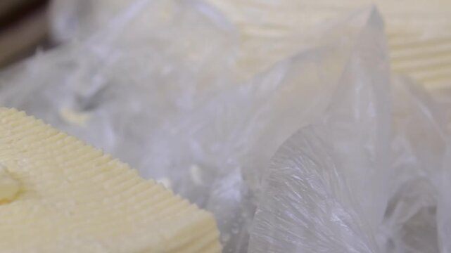 Brynza cheese. Fresh homemade brynza cheese sold at local market traditional dairy product packed and weighed for customer