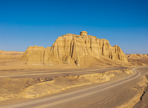 Aerial view of majestic yardang landforms in Gobi Desert at sunset, Dahai Dao, Xinjiang, China