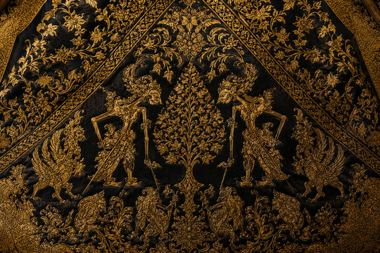 luxurious golden indonesian wayang gunungan traditional pattern on black background