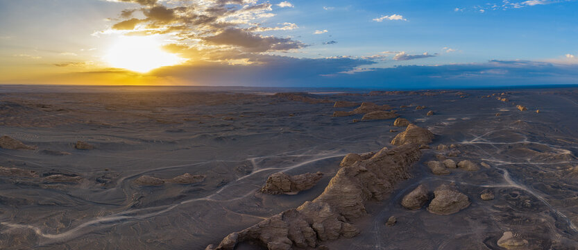 Aerial view of majestic yardang landforms in Gobi Desert at sunset, Dahai Dao, Xinjiang, China
